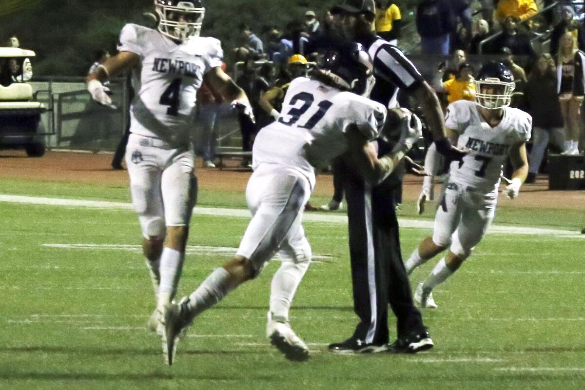 Newport Harbor's McKay Ketchum (31) makes an interception in the final minutes against Temecula Valley.