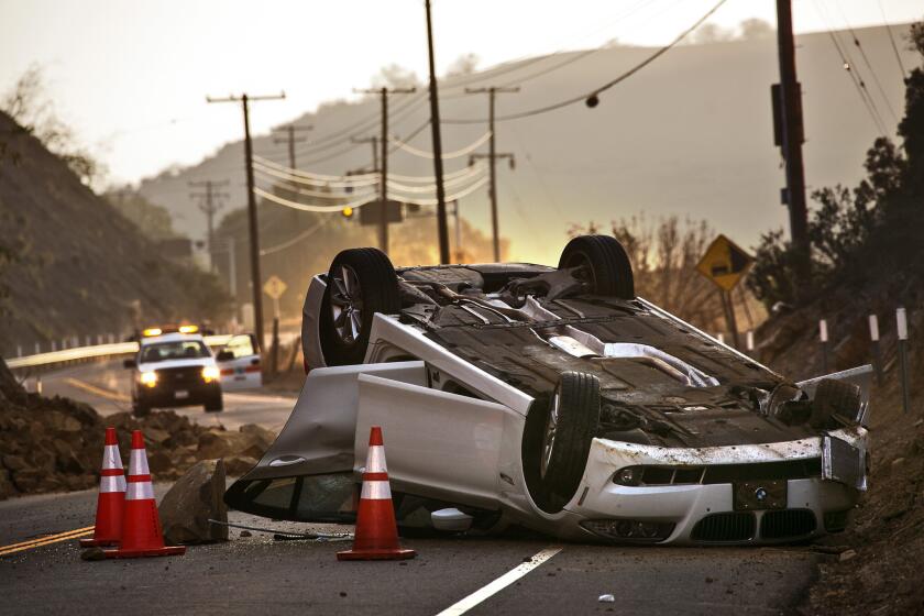 A magnitude 5.1 earthquake in Southern California on March 28 let loose a rock slide that overturned a vehicle in Carbon Canyon. Some lawmakers are seeking federal funds to support an earthquake warning system.