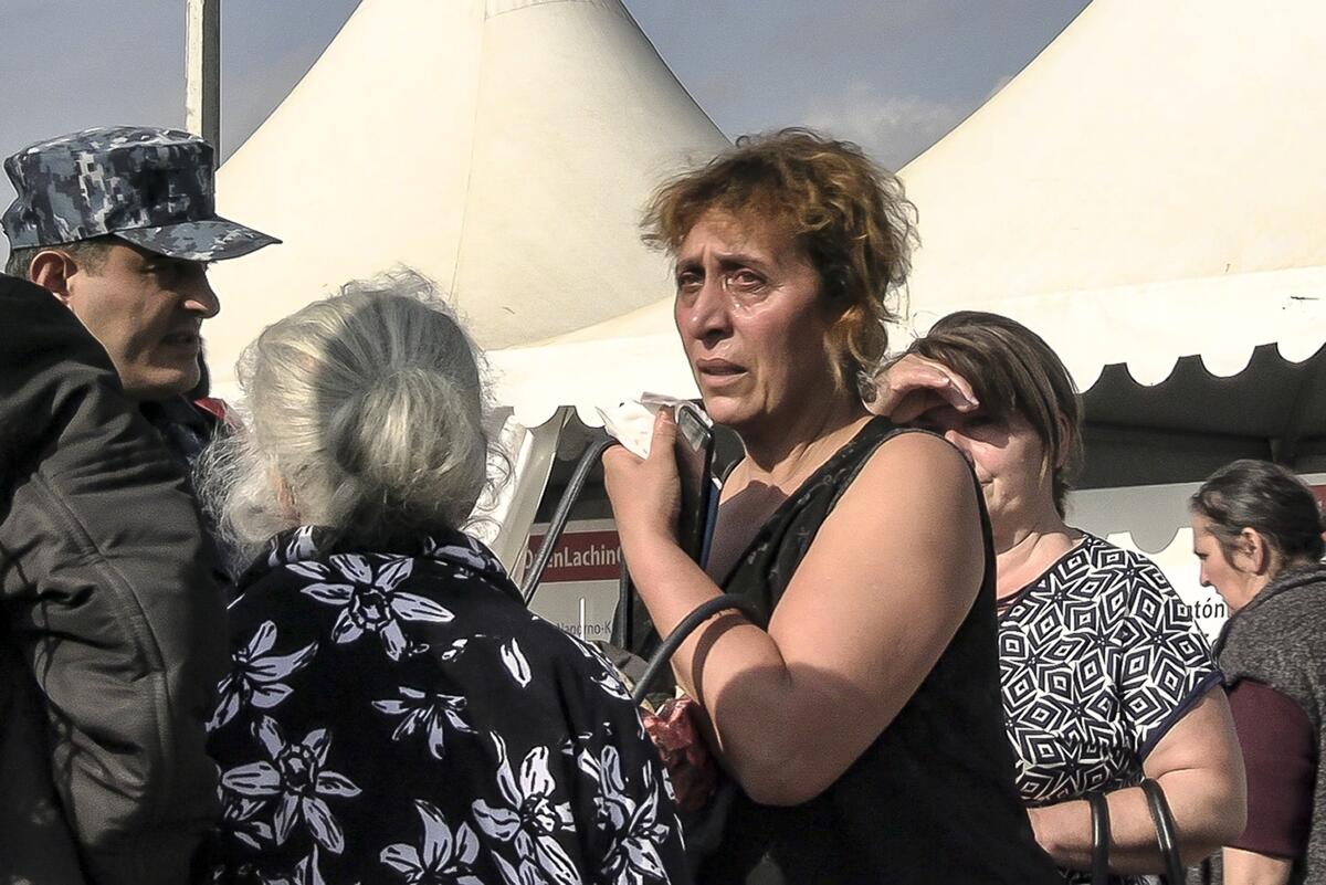 Woman crying in a temporary camp for refugees from Nagorno-Karabakh