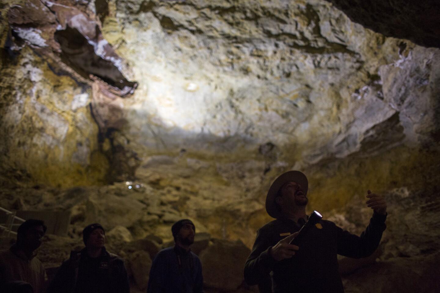 Park ranger and tour guide Brad Yoder, right, guides visitors through Jewel Cave National Monument, located south of Custer, S.D.