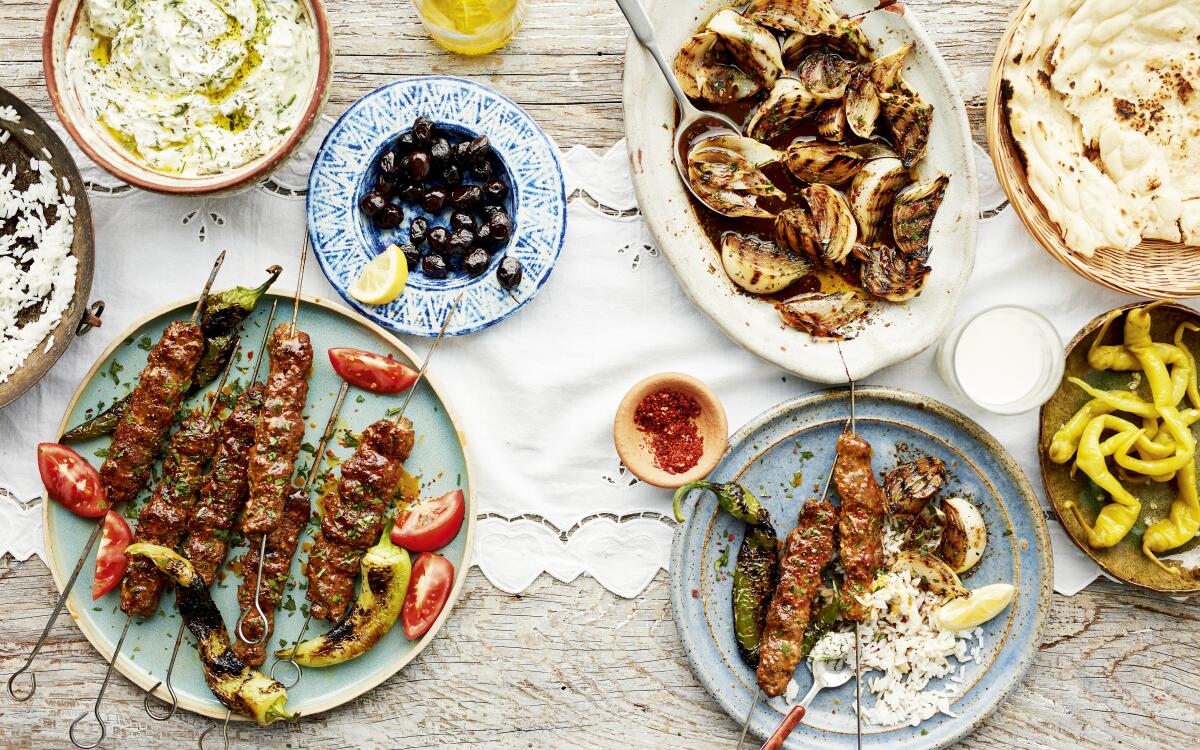 Ground lamb, spiked with chile paste, is molded around skewers and then grilled in these classic Turkish kebabs.