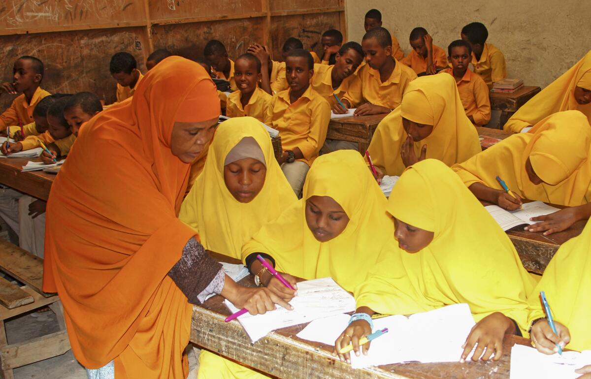 Somali schoolgirls finish their lessons