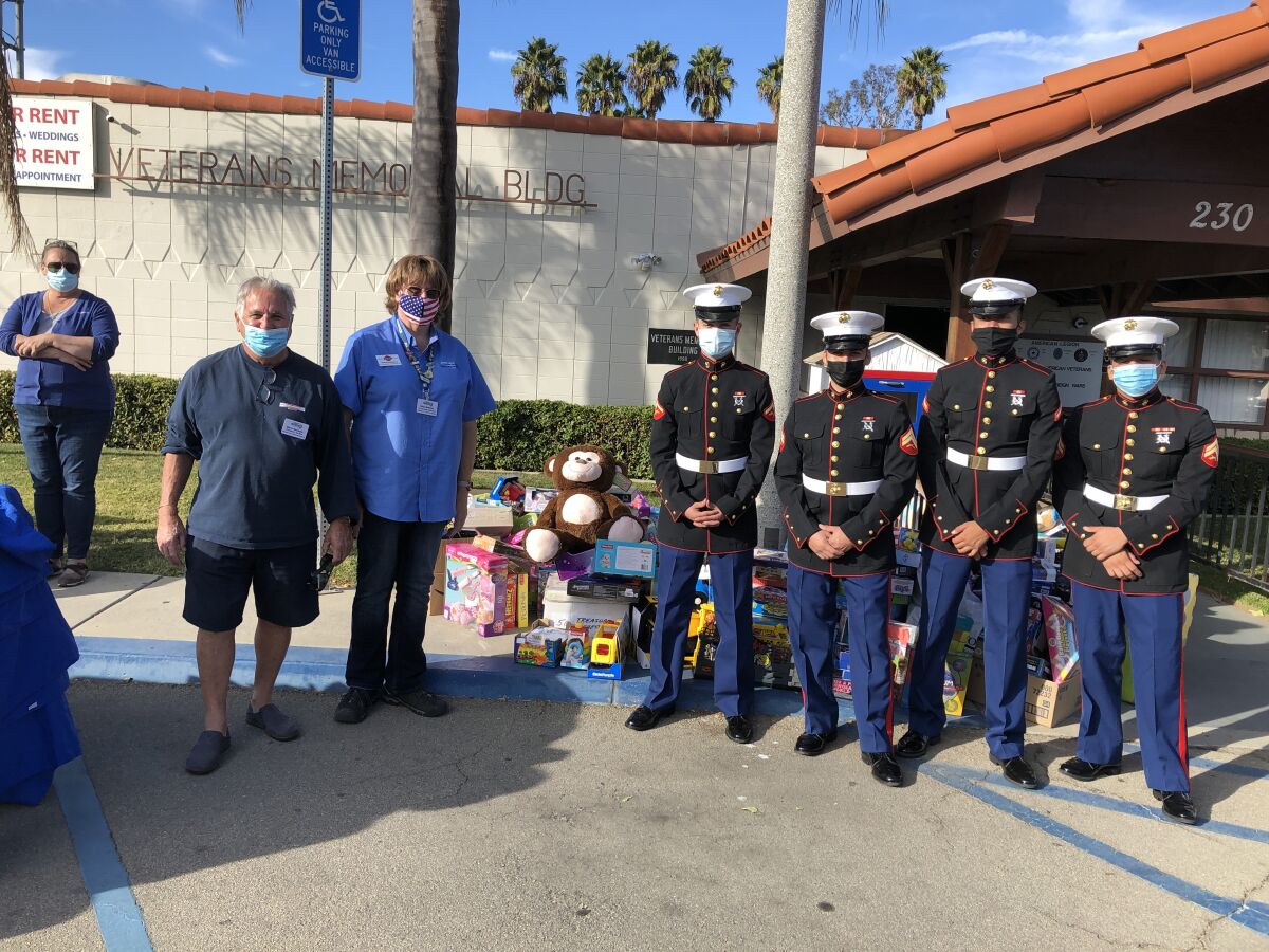 Nancy Wasco, Steve Gardella , Gina Roberts, four United States Marines from the local reserve unit.