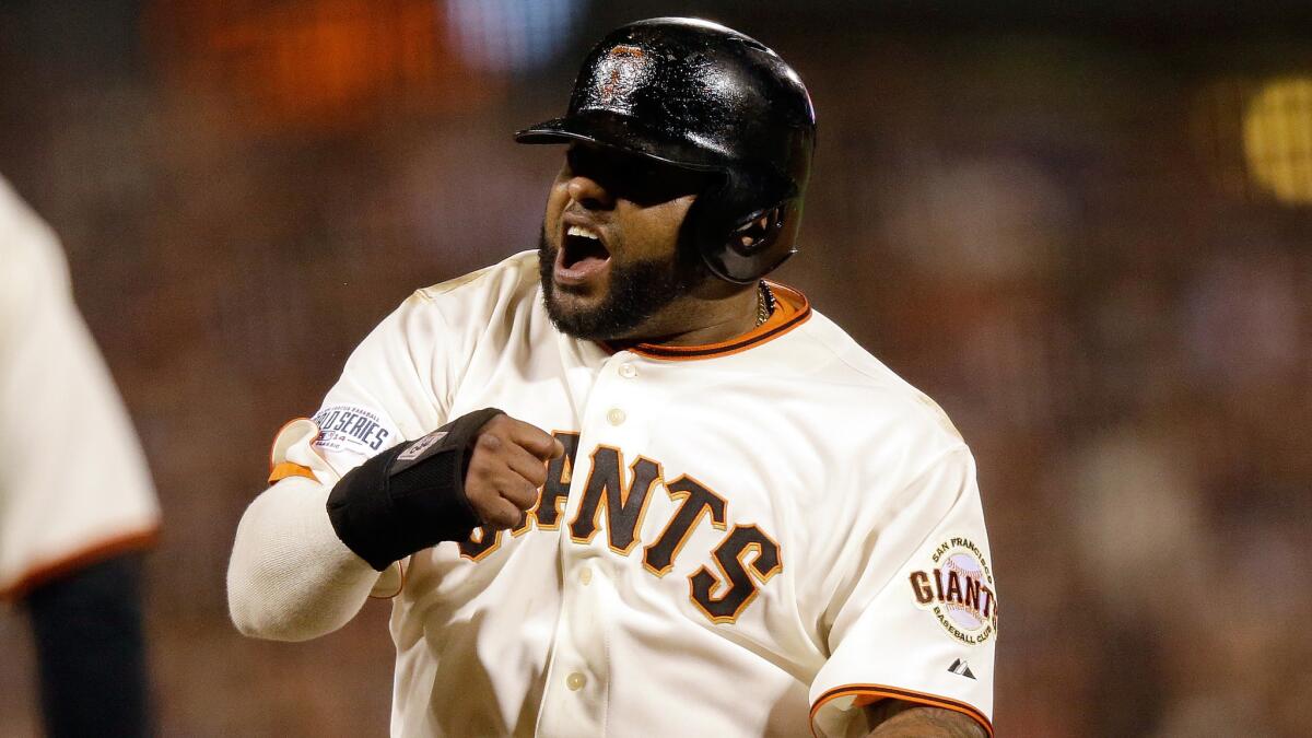 Pablo Sandoval celebrates during Game 4 of the World Series against the Kansas City Royals on Oct. 25, 2014. Sandoval signed with the Boston Red Sox in the off-season.