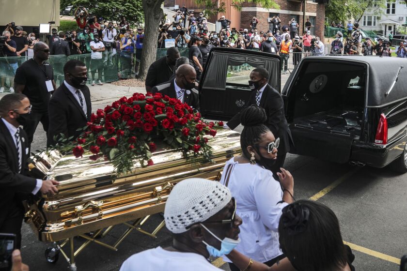 CORRECTS TO MEMORIAL SERVICE, NOT FUNERAL - George Floyd's casket carried to a hearse after a memorial service for Floyd at North Central University, Thursday, June 4, 2020, in Minneapolis. Floyd died after being restrained by Minneapolis police officers on May 25. (AP Photo/Bebeto Matthews)
