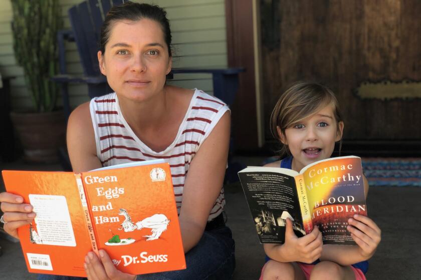 Ivy Pochoda and her daughter, Loretta, on their porch in West Adams, reading their favorite books.