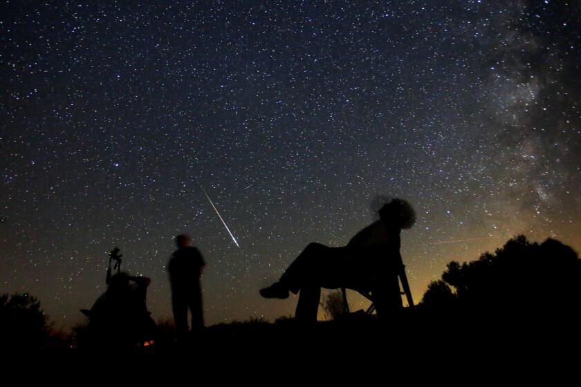 Star-gazers watch shooting stars above Anza-Borrego Desert State Park in Borrego Springs, Calif. during previous Perseid meteor showers.
