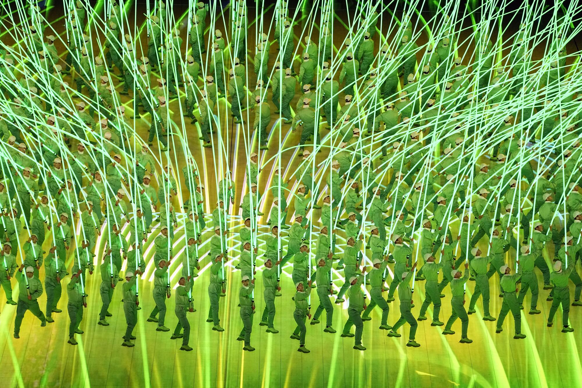 Dancers hold giant LED sticks meant to look like spring willows during the opening ceremony.