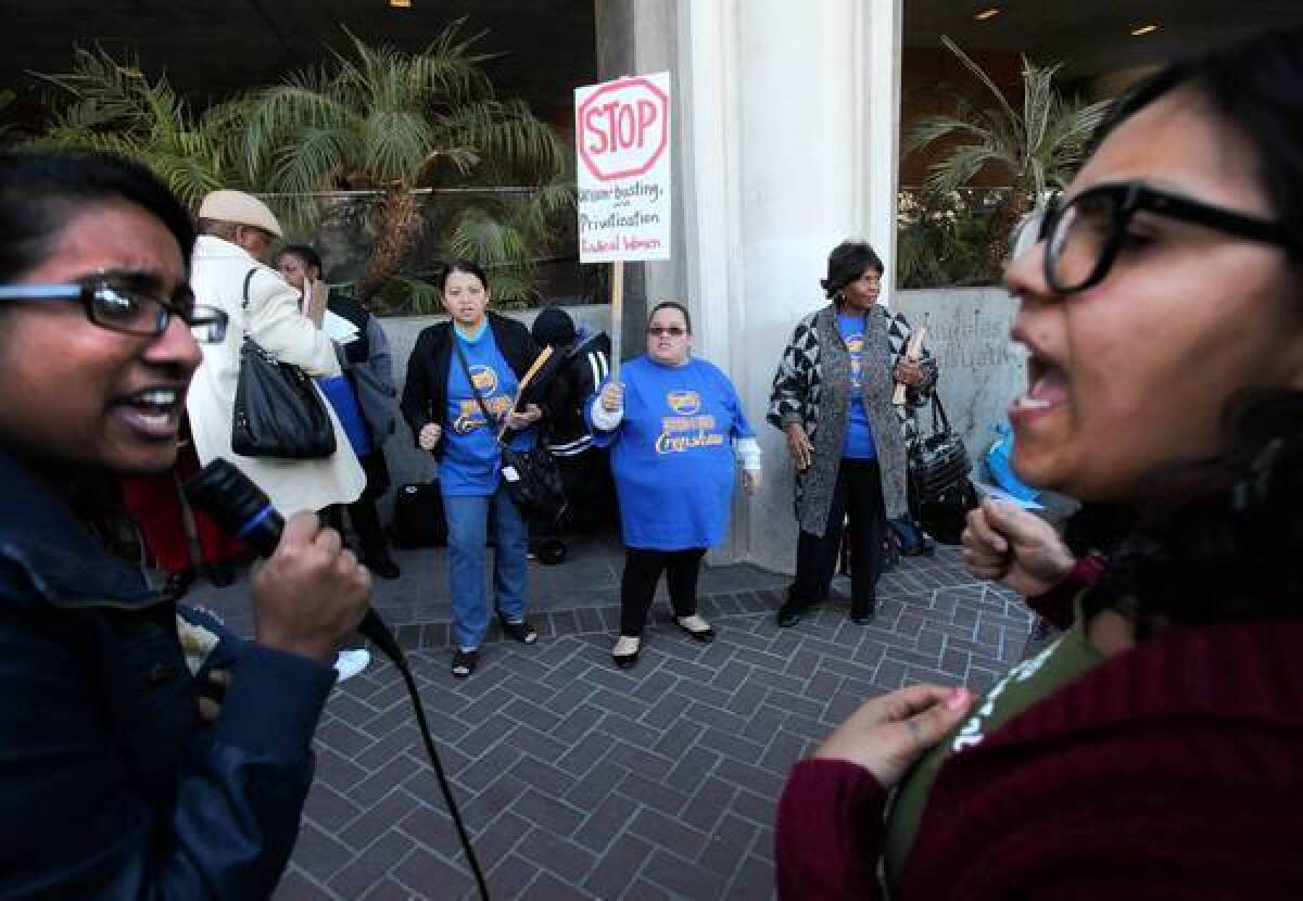 Shruti Purkayastha, left, and Carla Gonzalez lead a rally protesting L.A. Unified's plans to overhaul Crenshaw High.