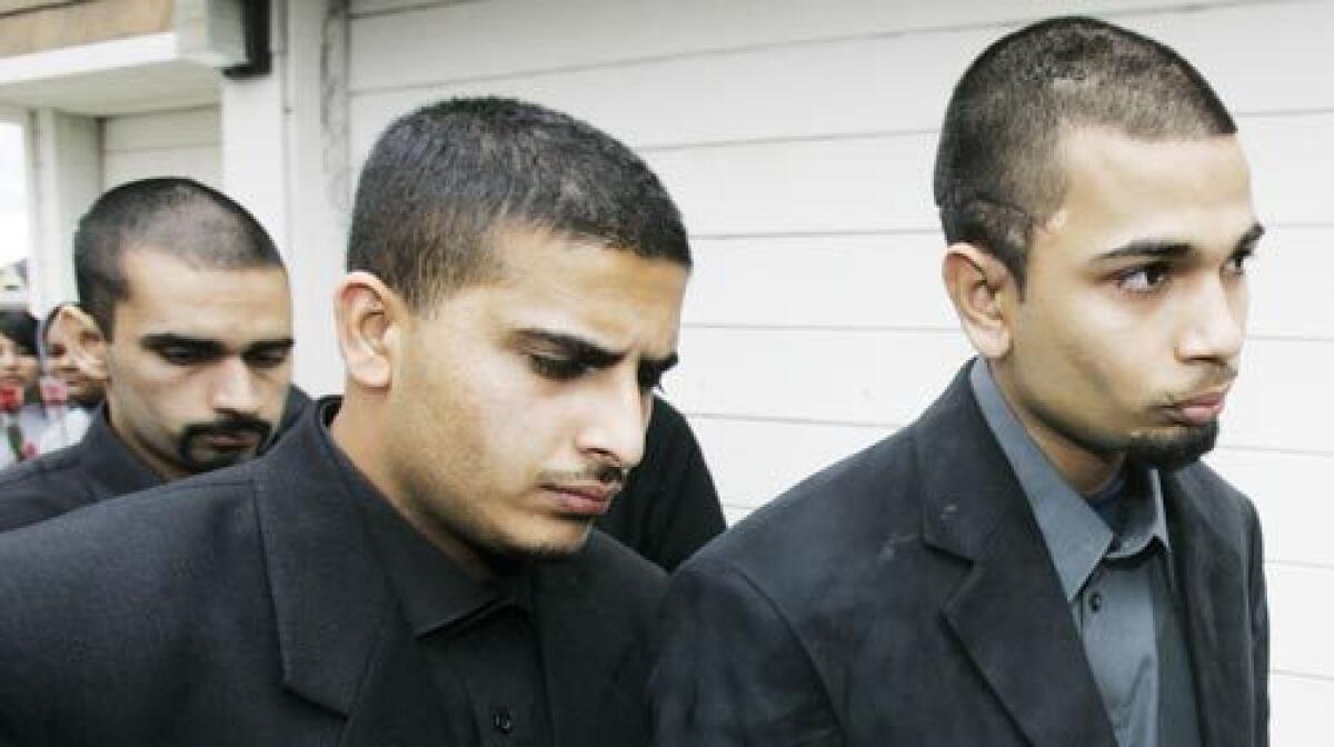Paul Dhaliwal, right, his brother Kulbir, far left, and an unidentified man leave the Jan. 8 funeral of Carlos Sousa Jr. in San Jose. Sousa was killed by a Siberian tiger that escaped its enclosure at the San Francisco Zoo. The Dhaliwal brothers were also attacked.