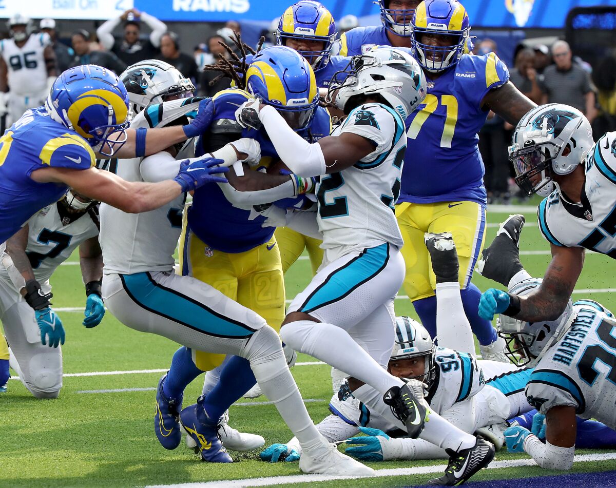 Rams rback Darrell Henderson Jr. powers into the end zone for a touchdown against the Panthers in the fourth quarter.