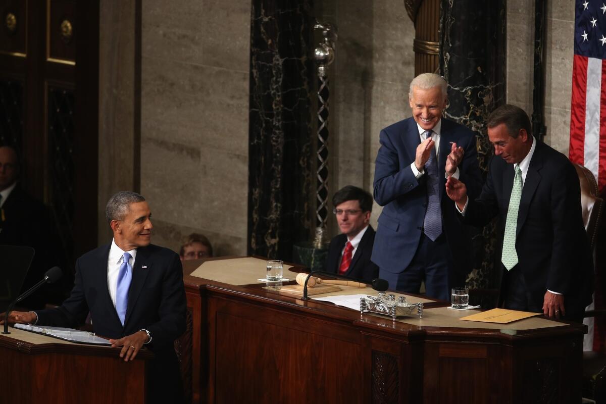 President Obama looks back at Vice President Joe Biden, left, and Speaker of the House John Boehner (R-Ohio) during the State of the Union address.