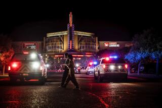 Movie-goers evacuate the Century Rio movie theater as officers respond to a shooting at the theater located at 4901 Pan American freeway in northeast Albuquerque, N.M., on Sunday, June 25, 2023. The Albuquerque Police Department said Monday that an argument over seat reservations escalated into a shooting that left a 52-year-old man dead and sent filmgoers scrambling for cover. Homicide charges were filed Monday against a 19-year-old who was wounded in the Sunday-night confrontation. (Chancey Bush/The Albuquerque Journal via AP)