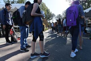 Students wait in line to cast their ballot at a polling station on the campus of the University of California, Irvine, on November 6, 2018 in Irvine, California on election day. - Americans vote Tuesday in critical midterm elections that mark the first major voter test of Donald Trump's presidency, with control of Congress at stake. (Photo by Robyn Beck / AFP) (Photo credit should read ROBYN BECK/AFP via Getty Images)