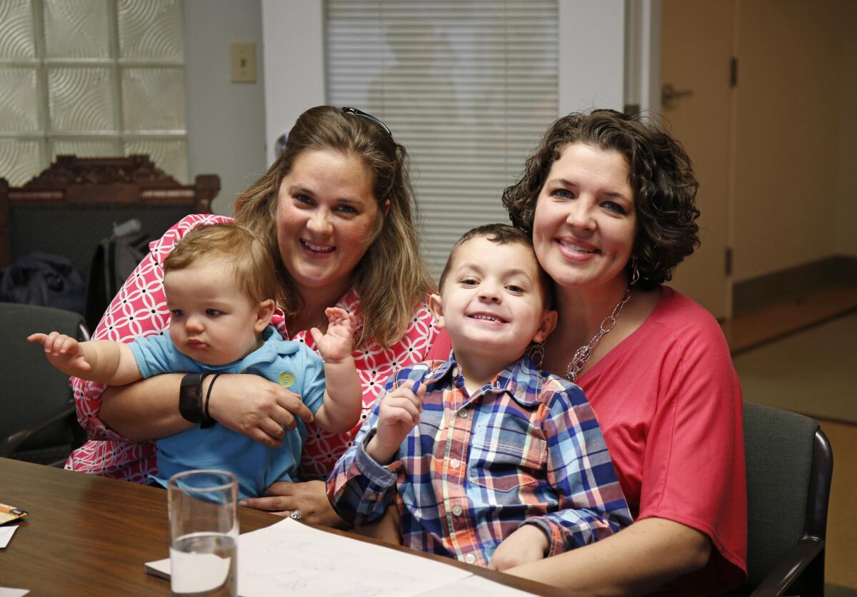 Supreme Court gay marriage plaintiffs Pam Yorksmith, left, and her spouse Nicole Yorksmith, along with their children, Grayden and Orion.