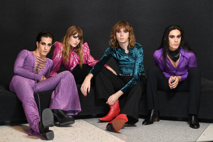 Los Angeles California November 4, 2021: Members of the Italian glam rock band "Maneskin" from left, Damiano David, Victoria De Angelis, Thomas Raggi and Ethan Torchio before a radio performance in Los Angeles. (Wally Skalij/Los Angeles Times)