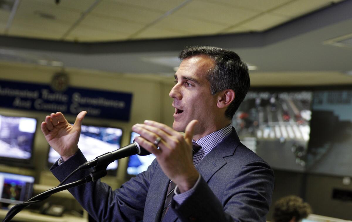Los Angeles Mayor Eric Garcetti speaks at a news conference to mark his 100th day in office.