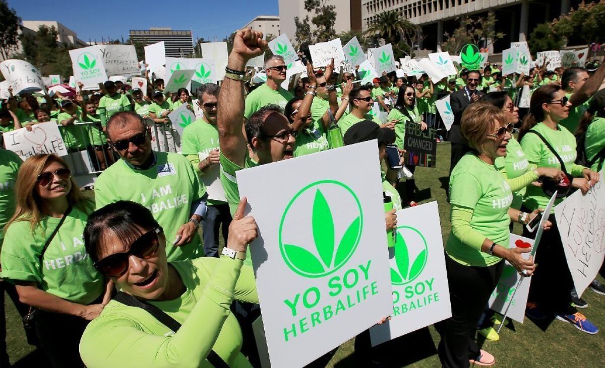 Herbalife Ltd. supporters rallied Wednesday in downtown Los Angeles' Grand Park.