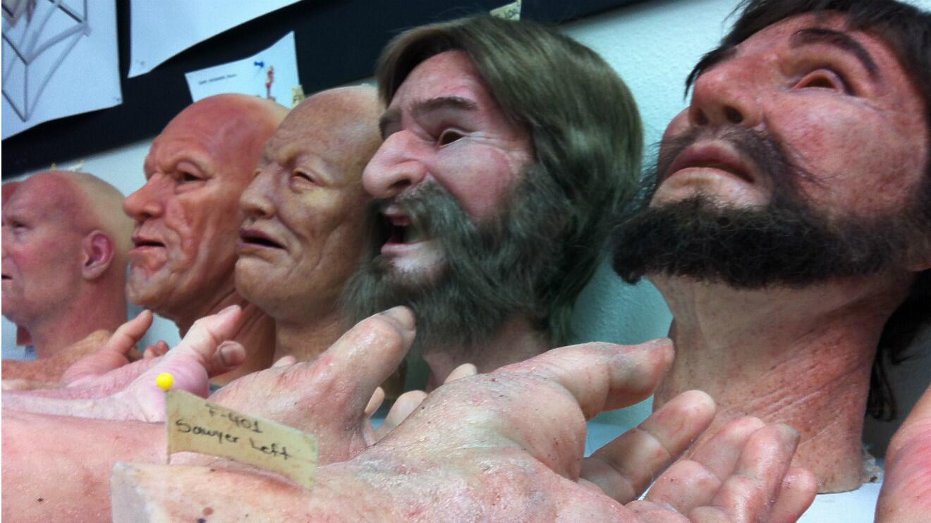 Rows of lifelike silicone faces and hands at Garner Holt Productions await their placement on the animatronic miners in the Calico Mine Ride at Knott's Berry Farm.