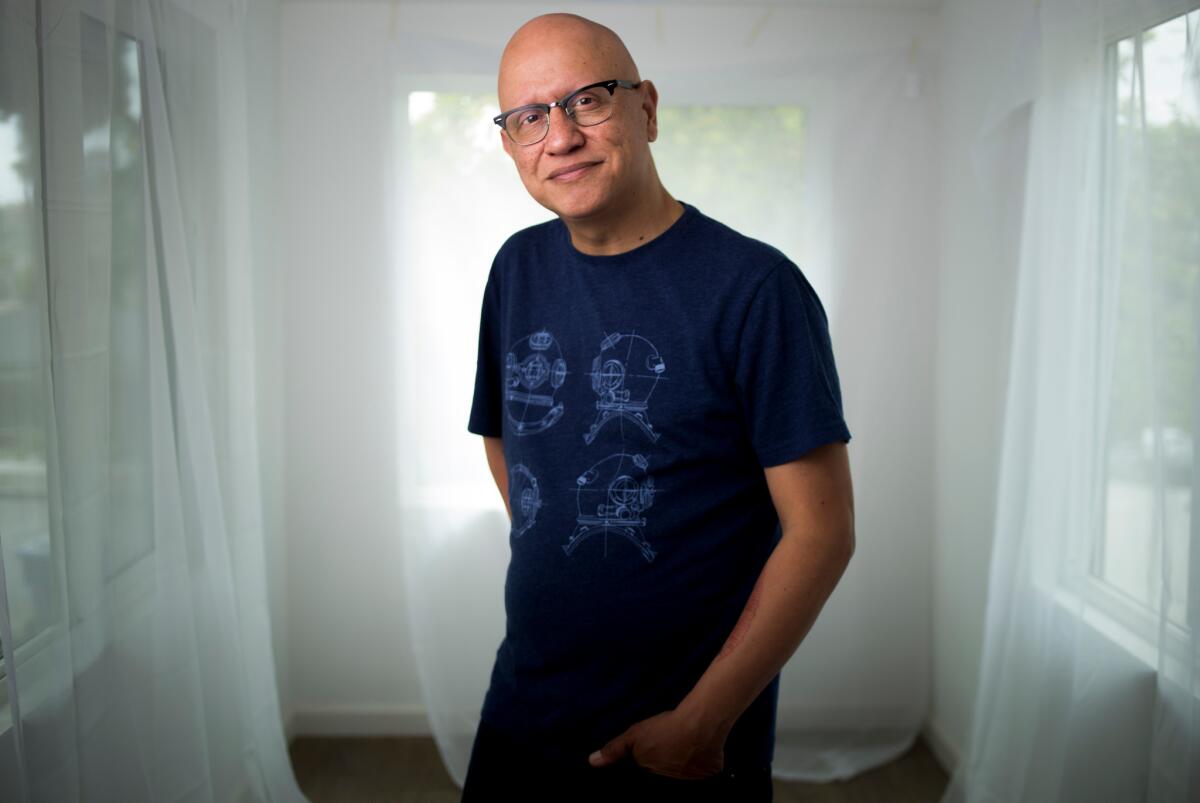 Author Alex Espinoza at his home in Los Angeles. Espinoza is director of the graduate creative writing and literary arts program at Cal State L.A.