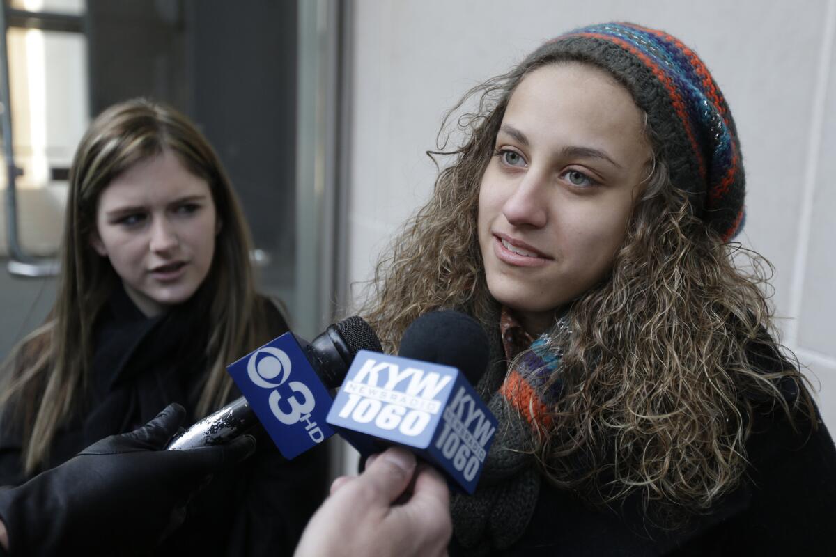 Easton Area School District students Brianna Hawk, 15, left, and Kayla Martinez, 14, speak to reporters outside the U.S. Courthouse in Philadelphia on Feb. 20. A federal appeals court ruled Aug. 5 that the district cannot ban "I (heart) Boobies!" bracelets, rejecting the district's claim that the slogan ¿ designed to promote breast cancer awareness among young people ¿ is lewd. The ruling is a victory for Hawk and Martinez, who challenged the school rule in 2010 with help from the American Civil Liberties Union.