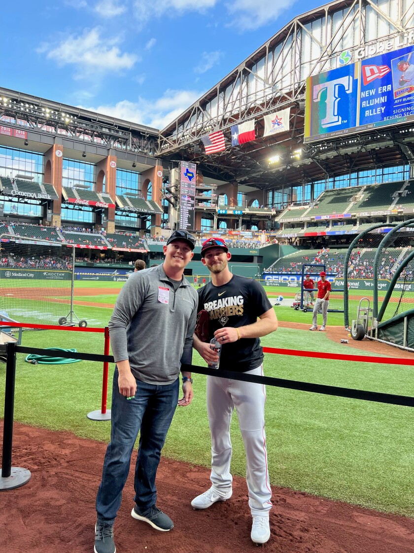 Trent Woodward, left, and Taylor Ward reunite before an Angels game against Rangers in Arlington, Texas this season.