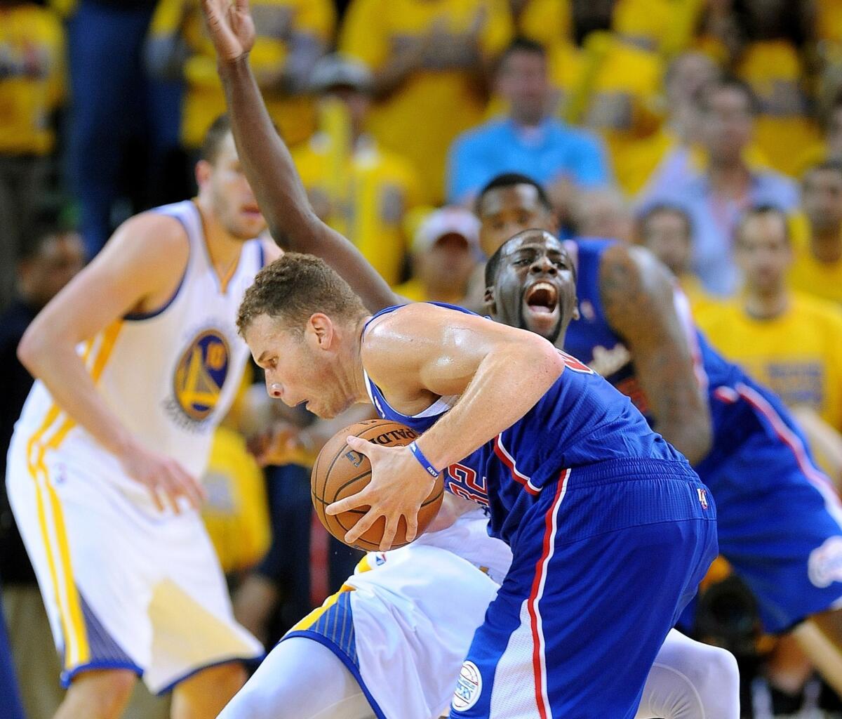 Clippers power forward Blake Griffin's drive is cut off by Warriors power forward Draymond Green in Game 3 of the first-round Western Conference playoffs series, but Green is called for a blocking foul.