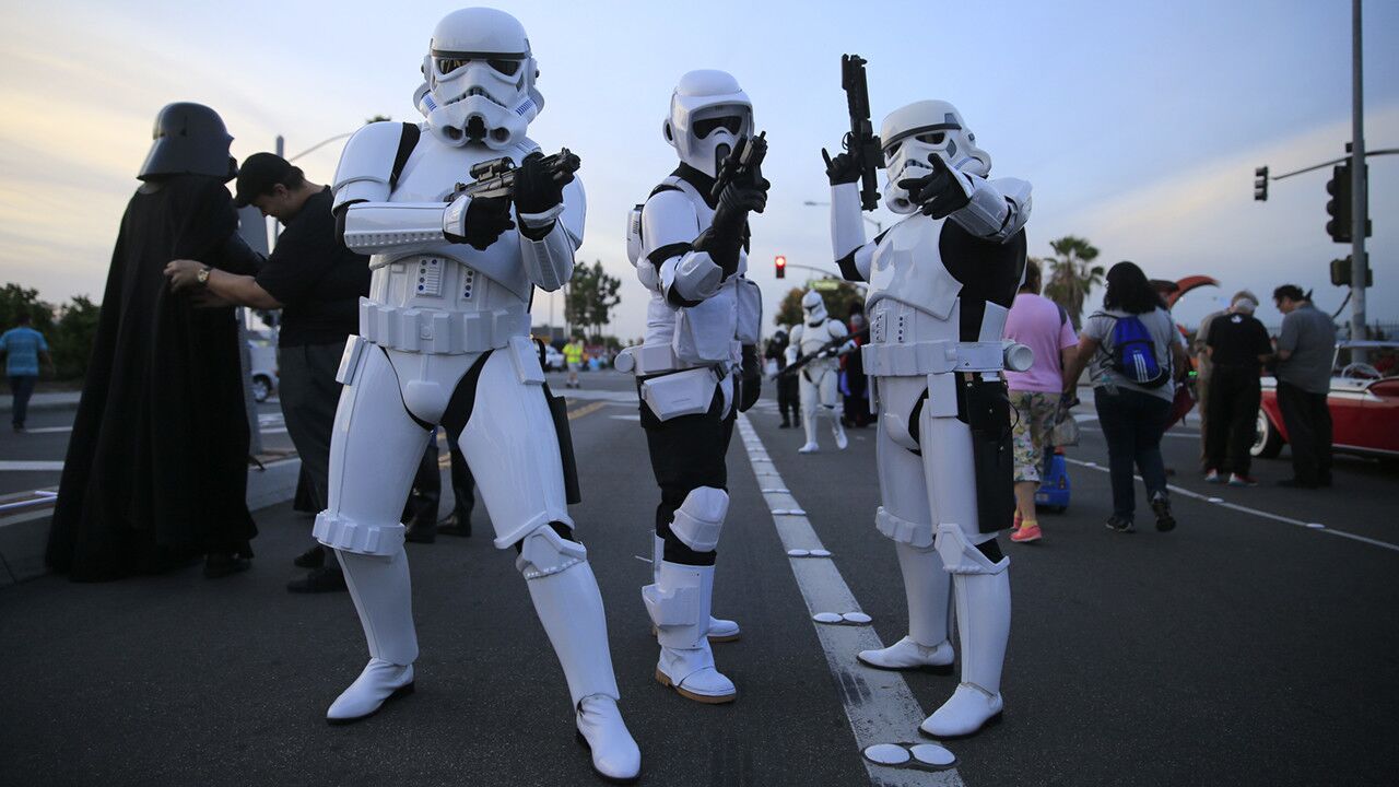 Members of the 501st Legion and the Orange County Star Wars Society prepare to march in Stormtrooper costumes during the Anaheim Halloween Parade on Oct. 24. A group of cosplayers/fans dressed as their favorite "Star Wars" character march in the Anaheim Halloween Parade. ------------For the Record: Oct. 30, 7:30 p.m. Slides 11 through 13 of this photo gallery incorrectly refer to the 501st Legion as the 501st Rebel Legion.------------
