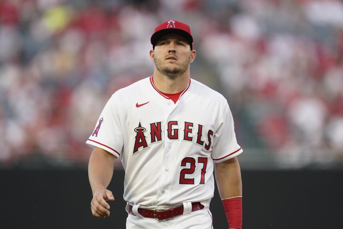 Angels center fielder Mike Trout walks on the field to warm up before a game.