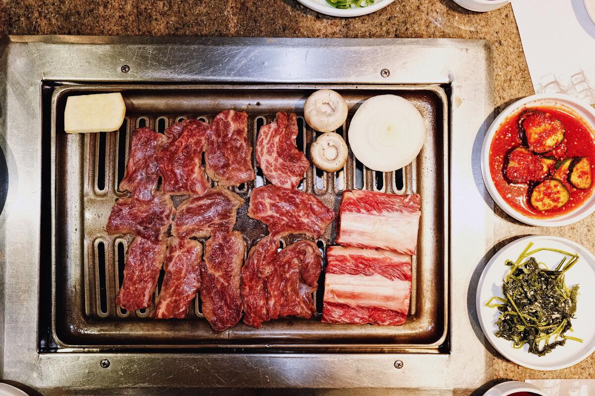 An overhead photo of the signature galbi on the grill at Chosun Galbee in Koreatown.