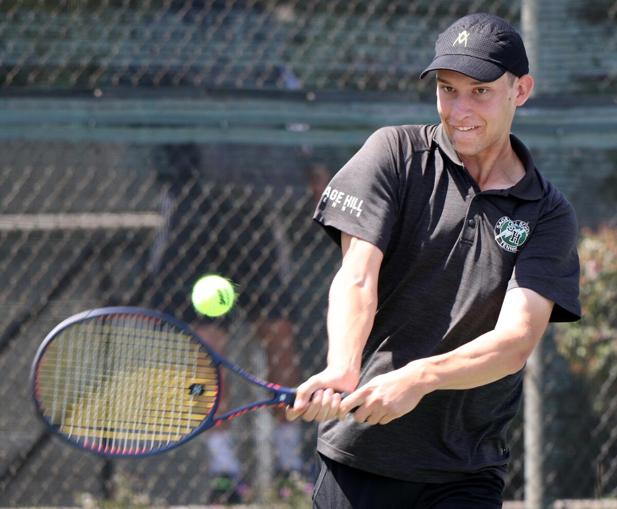 Sage Hill's Emin Torlic returns the ball in the round of 16 singles match in the CIF Southern Section Individuals tournament against Corona del Mar's Kyle Pham at Seal Beach Tennis Center on Wednesday.