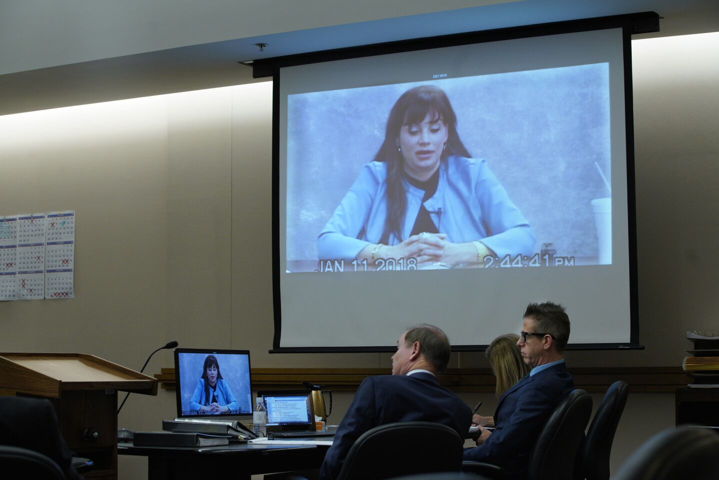 Adam Shacknai and his attorneys, Dan Webb (left) and Krista M. Enns watched the video deposition of Dina Shacknai taken on January 11, 2018 as it is played in court during the civil trial for the wrongful death of Rebecca Zahau in San Diego Superior Court.