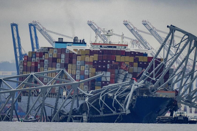 FILE - The container ship Dali, owned by Grace Ocean PTE, rests against wreckage of the Francis Scott Key Bridge in the Patapsco River on Wednesday, March 27, 2024, as seen from Pasadena, Md. (AP Photo/Alex Brandon, file)
