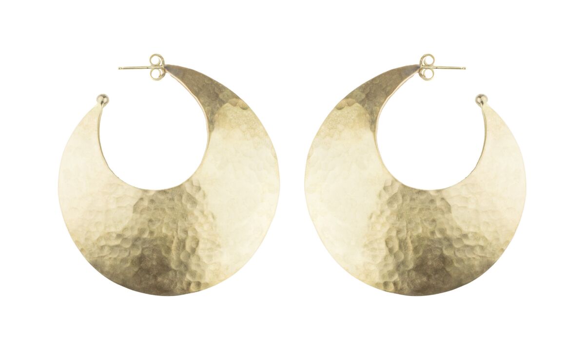 Kendall Conrad pounded brass Cresta hoop earrings with sterling silver posts, $230 at Kendall Conrad stores in Venice and Brentwood, kendallconraddesign.com.