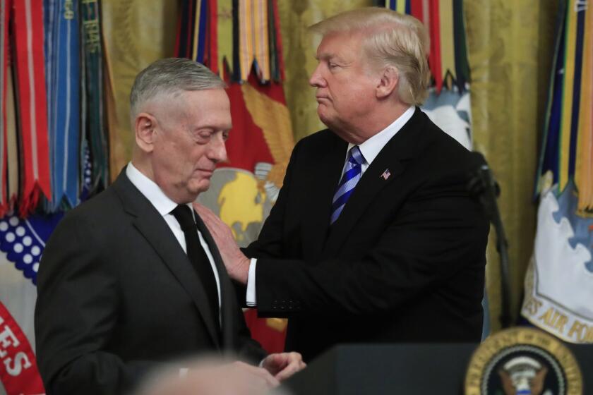 President Donald Trump acknowledges Defense Secretary Jim Mattis during a reception commemorating the 35th anniversary of the attack on Beirut Barracks in the East Room at the White House in Washington, Thursday, Oct. 25, 2018. (AP Photo/Manuel Balce Ceneta)