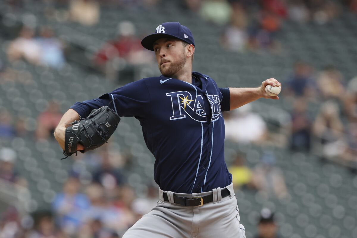 Tampa Bay Rays starting pitcher Jeffrey Springs (59) throws during the first inning of a baseball game against the Minnesota Twins, Sunday, June 12, 2022, in Minneapolis. (AP Photo/Stacy Bengs)