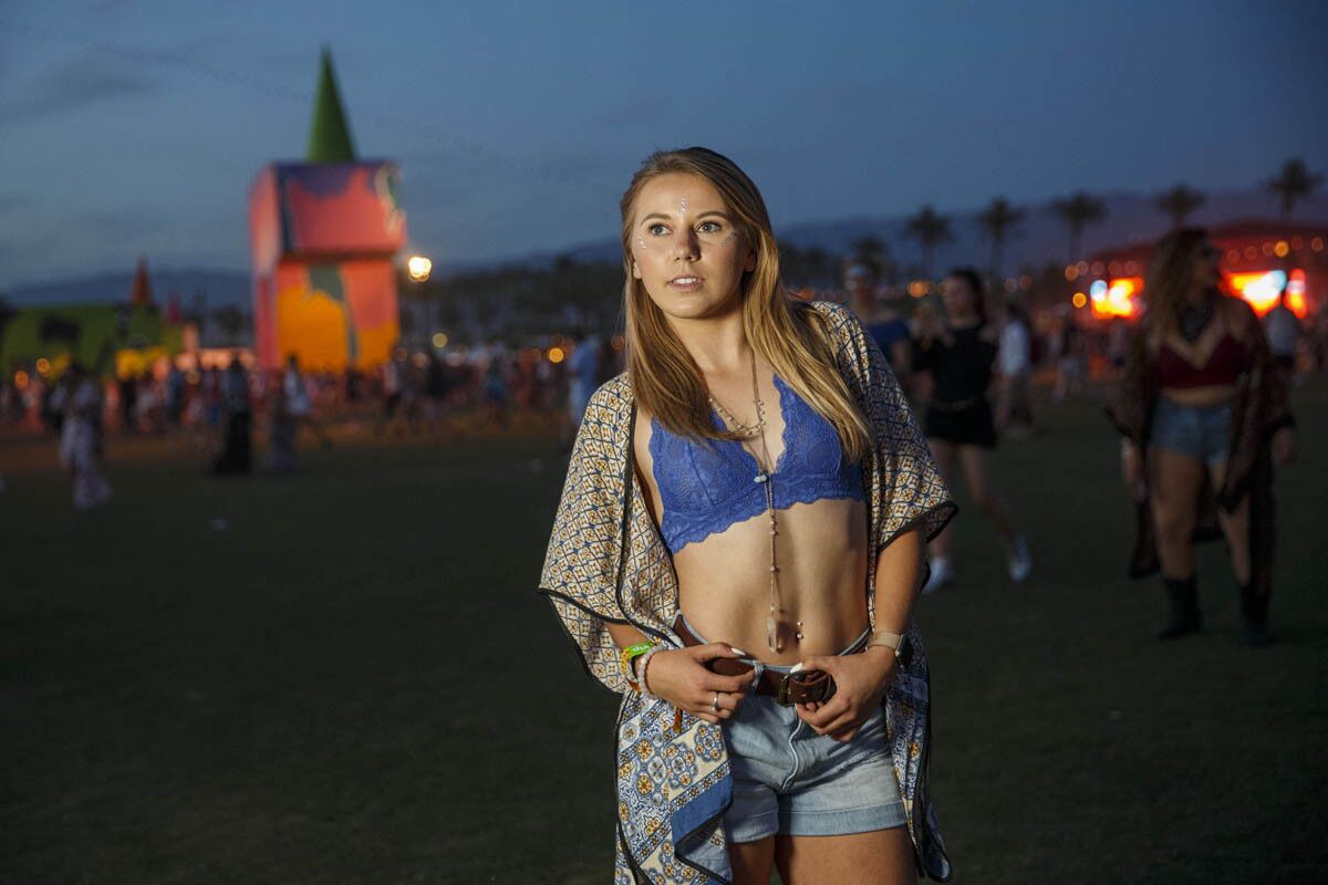 Kayla Ernst, 19, of San Jose, went with minimalist makeup and a maxi print, as she poses for a portrait during weekend one of the three-day Coachella Valley Music and Arts Festival at the Empire Polo Grounds on Saturday, April 15, 2017 in Indio, Calif. (Patrick T. Fallon/ For The Los Angeles Times)