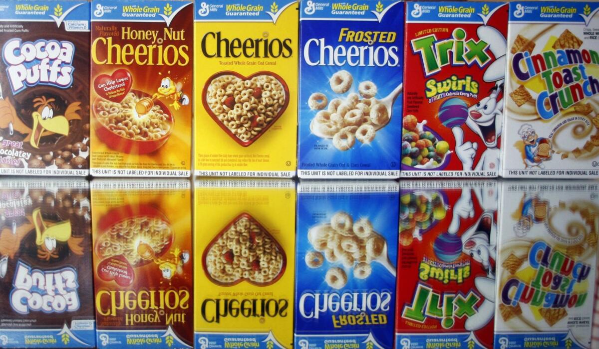 General Mills said Monday it is dropping artificial colors and flavors from its cereals.