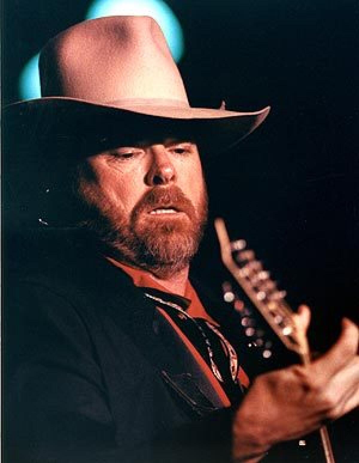Dan Seals, seen here performing in January 1993 at the Crazy Horse in Santa Ana, died of complications from cancer. He was 61.