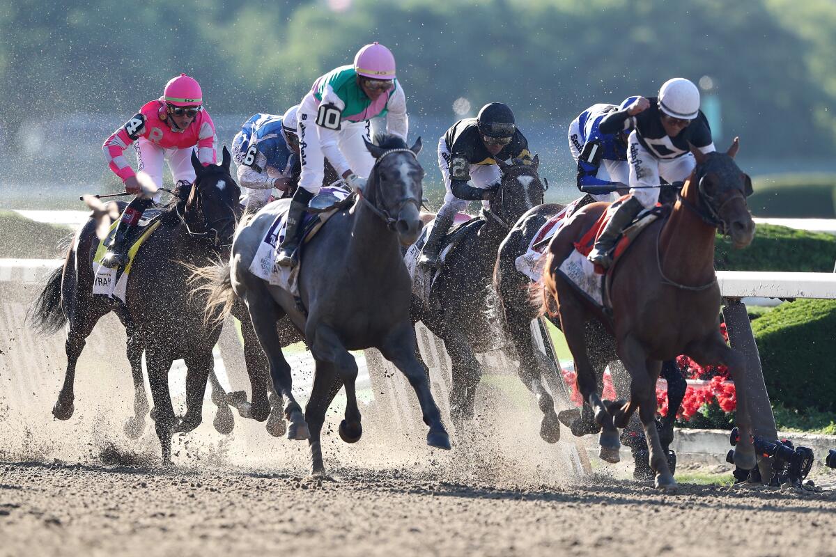 Jockey Joel Rosario rides Sir Winston, right, to victory during the 2019 Belmont Stakes.