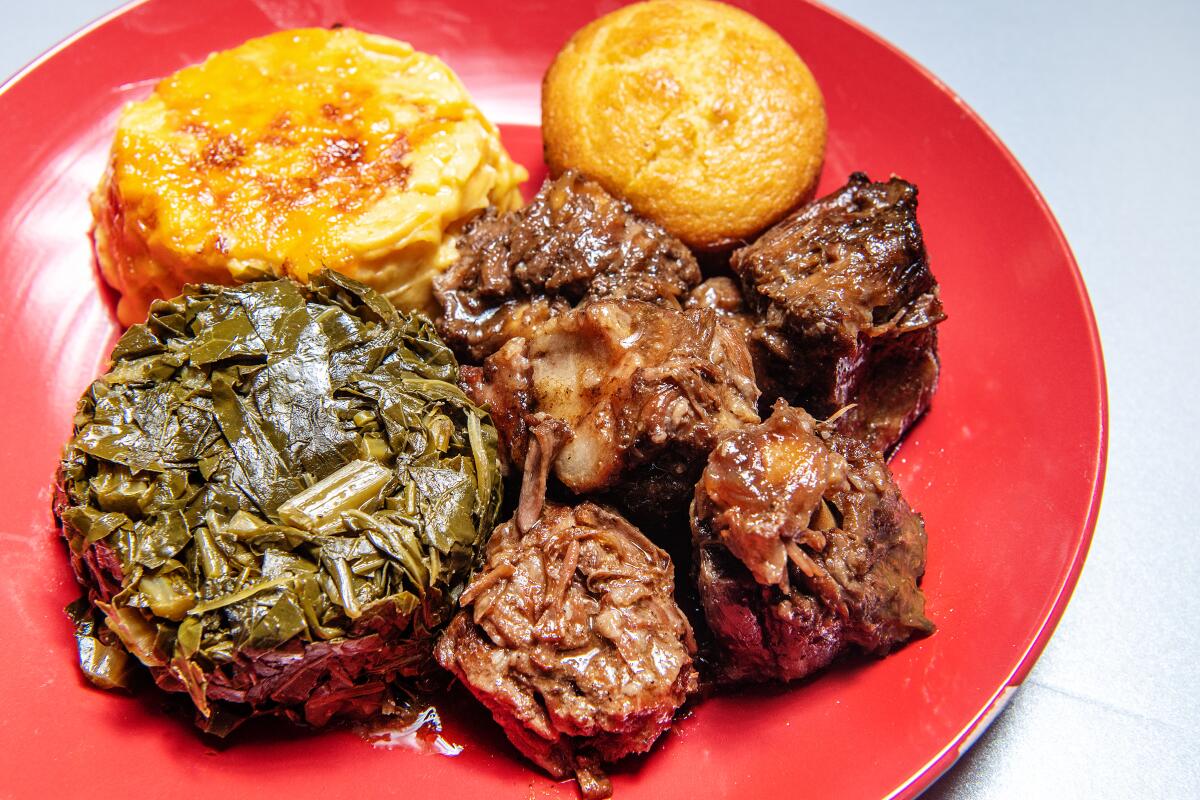 LOS ANGELES, CA - OCTOBER 13: Oxtail with collard greens, mac and cheese and cornbread from Dulan's Soul Food Kitchen on Tuesday, Oct. 13, 2020 in Los Angeles, CA. (Mariah Tauger / Los Angeles Times)