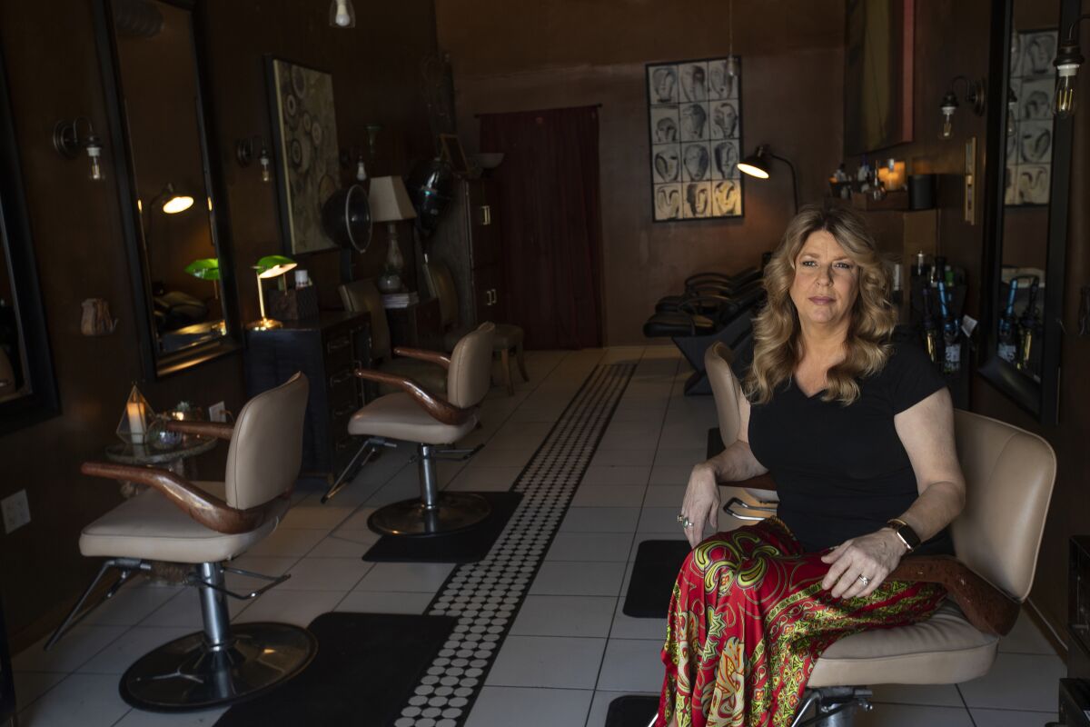 Elaina Wilcox, owner of Color & Craft, fears she could lose her salon if there are longer delays getting California hairdressers back to work.