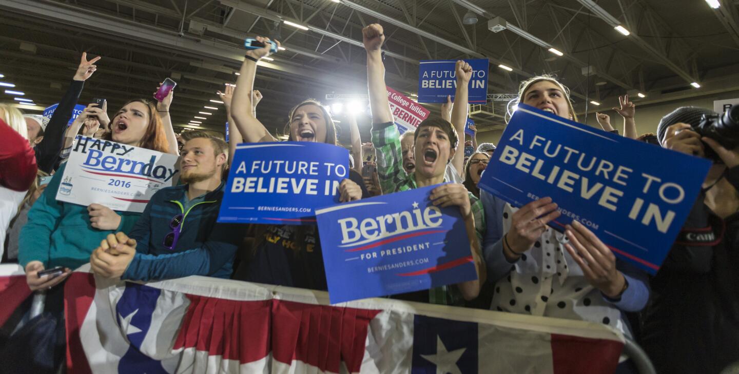 Supporters of Democratic presidential candidate Bernie Sanders cheer during a rally in Madison, Wis.