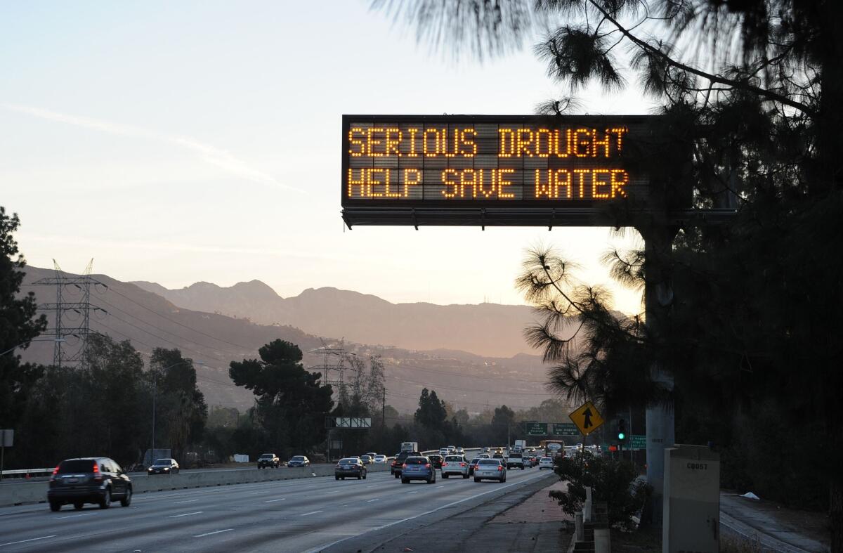 A highway sign in Glendale warns motorists to save water in response to California's severe drought.