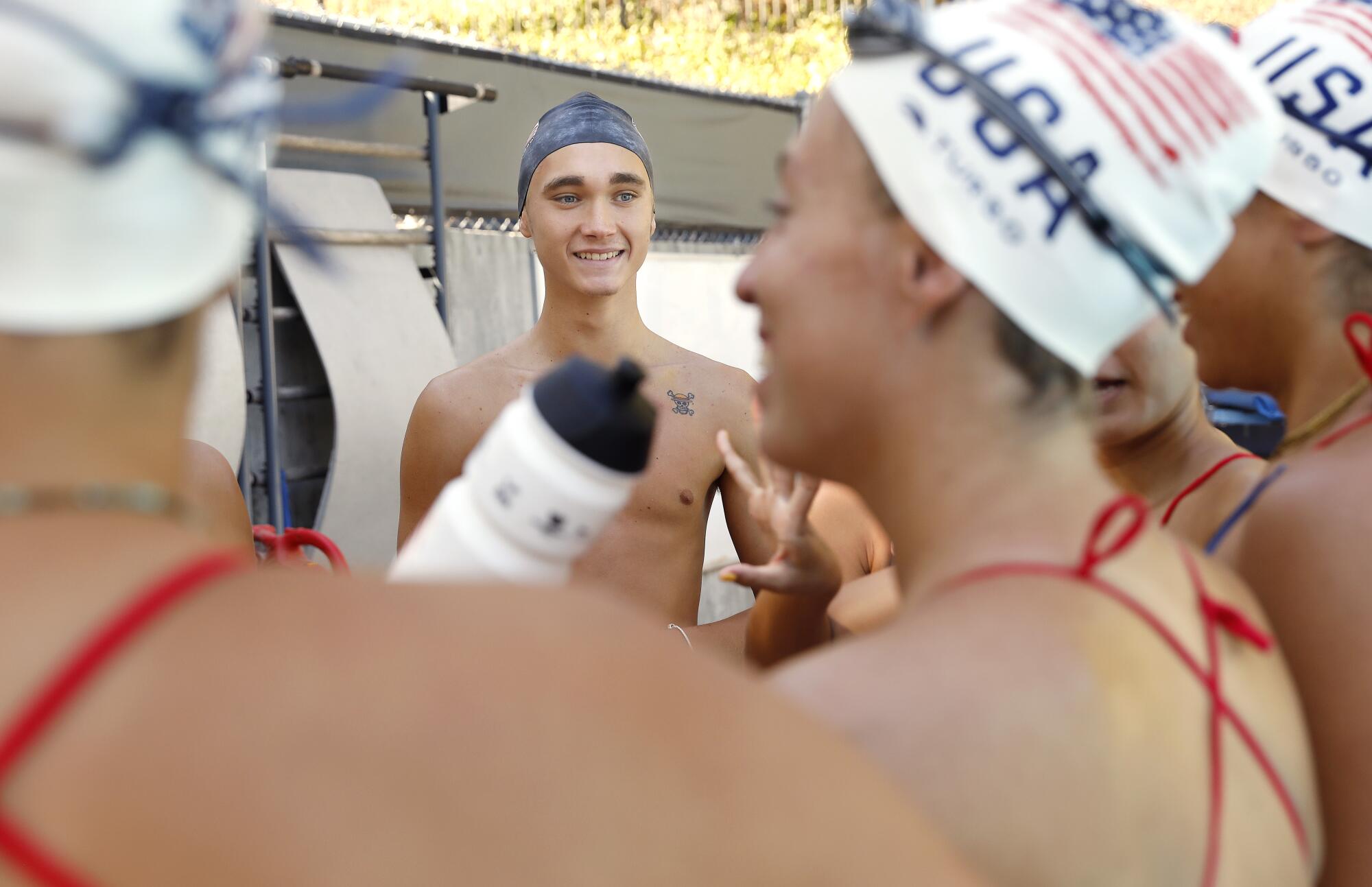 The USA Artistic Swimming team, including Kenny Gaudet, center, gathers for practice at UCLA in September 2022. 