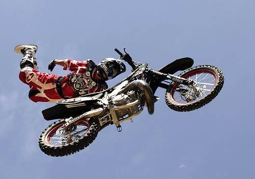 Brian Deegan, 31, shows-off his skill on a motorbike during a practice session in Temecula. Deegan returns to the X-Games following a horrific crash that nearly cost him his life last year in a commercial TV shoot.