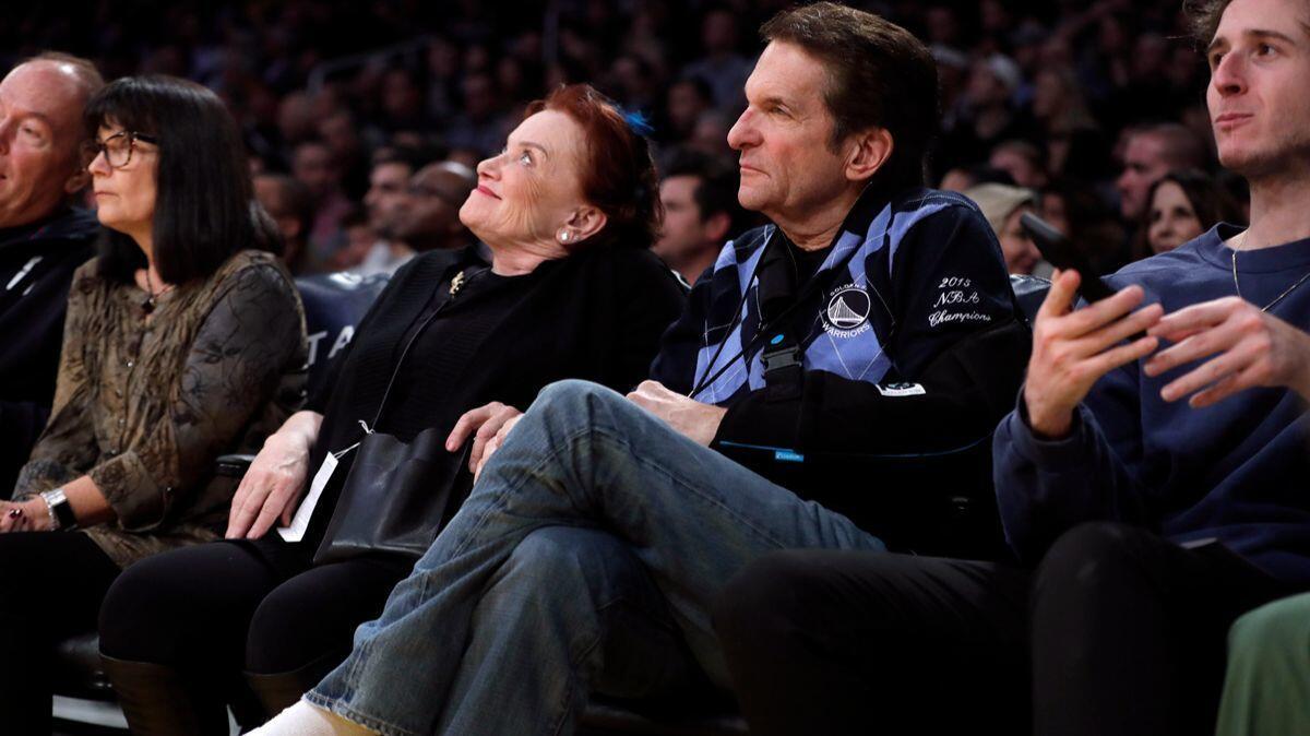 Peter Guber sits courtside with his wife, Tara, as the Lakers play the Golden State Warriors at Staples Center on Nov. 29.