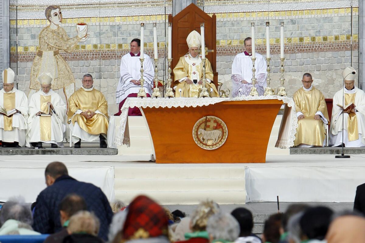 Then-Pope Benedict XVI celebrates a Mass in front of the Basilica of the Rosary in Lourdes.