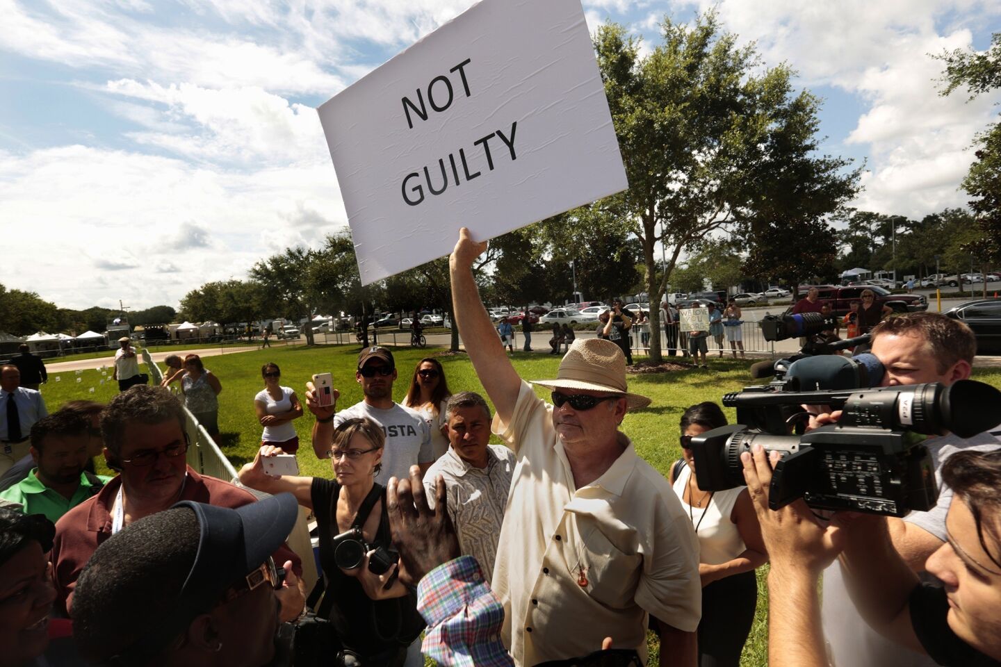 A supporter of George Zimmerman demonstrates outside the courthouse in Sanford, Fla., where a crowd awaits a jurty's verdict. Zimmerman is charged with second-degree murder in the shooting death of teenager Trayvon Marton. Zimmerman contends it was self-defense.
