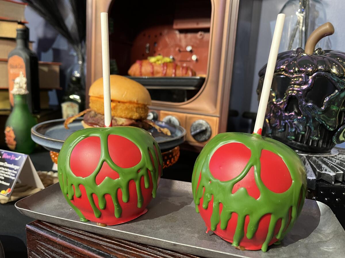 A Poison Skull Apple dipped in caramel and white chocolate.